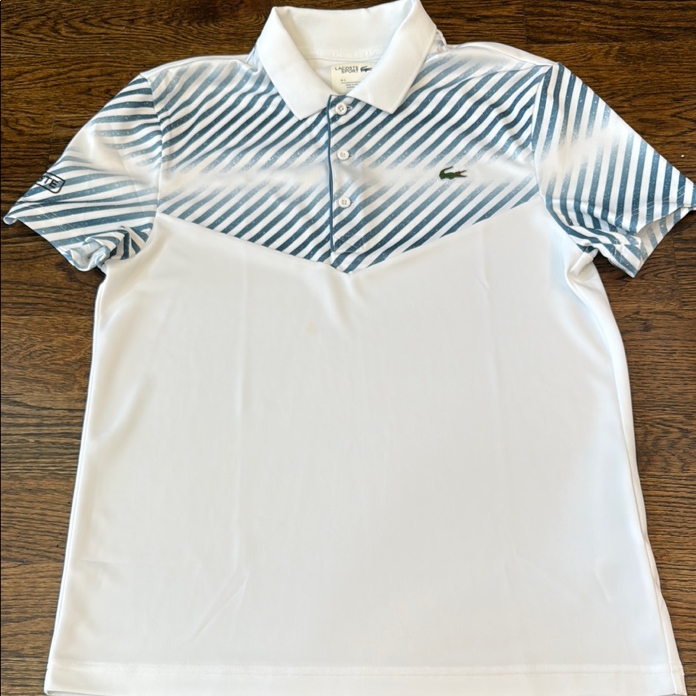 Lacoste Blue and White Polo Shirt with Dynamic Stripes